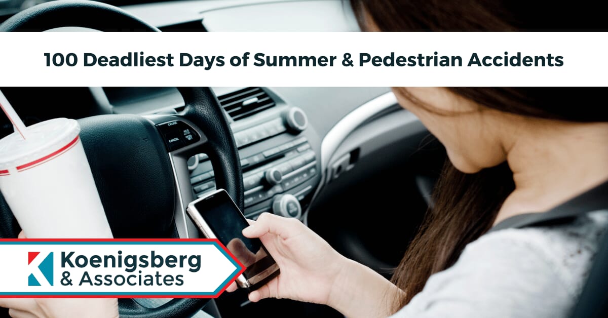 Woman checking phone, and holding a drink, while driving