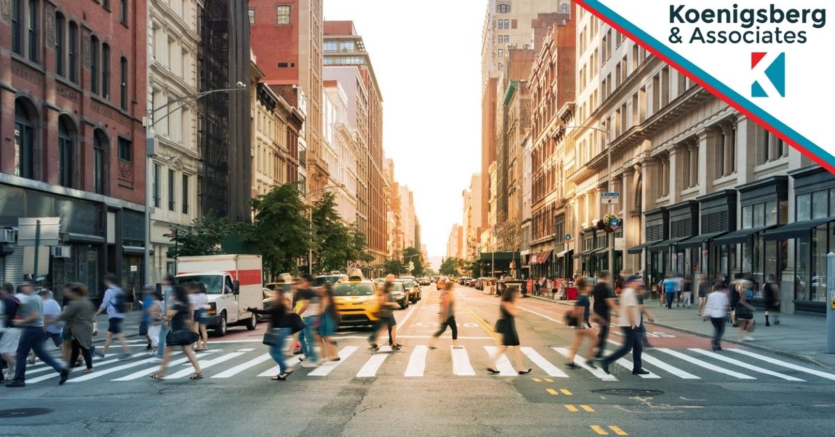 Busy new york street, including cars, busses, and pedestrians crossing