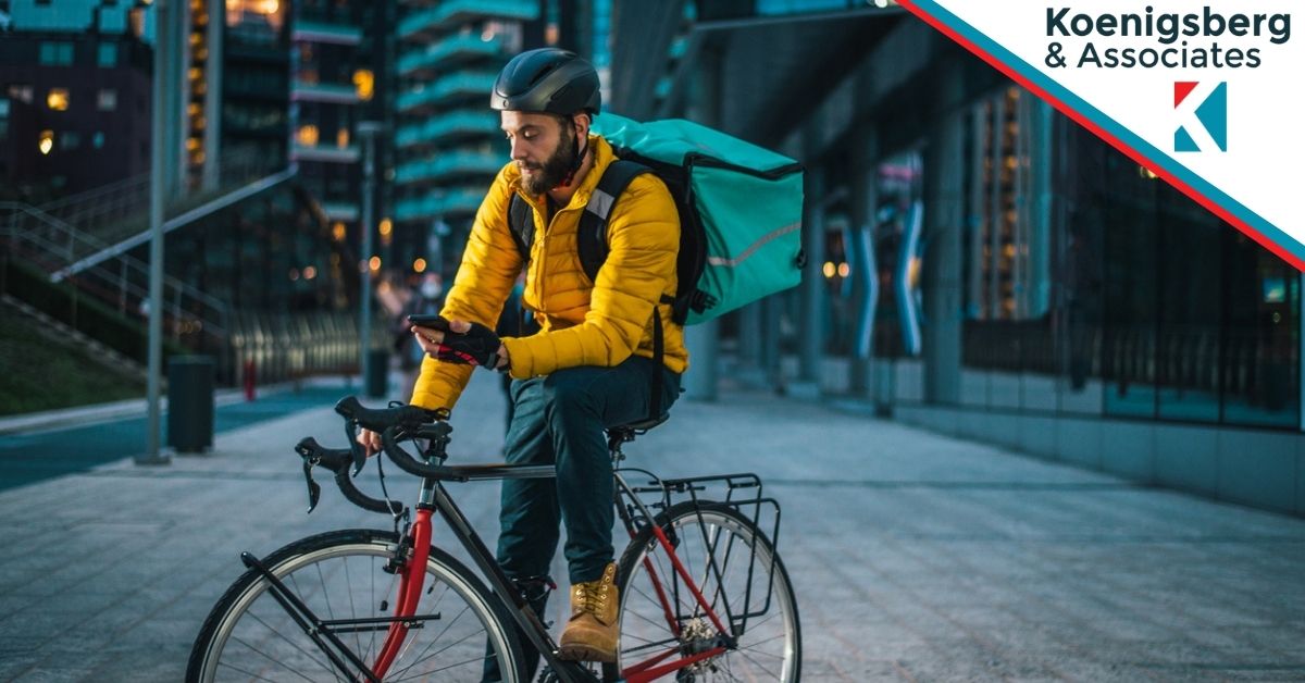 Delivery cyclist checking phone