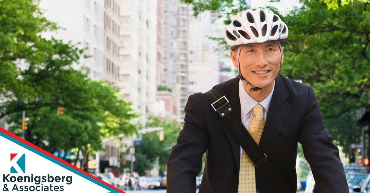 Smiling cyclist on their way to work