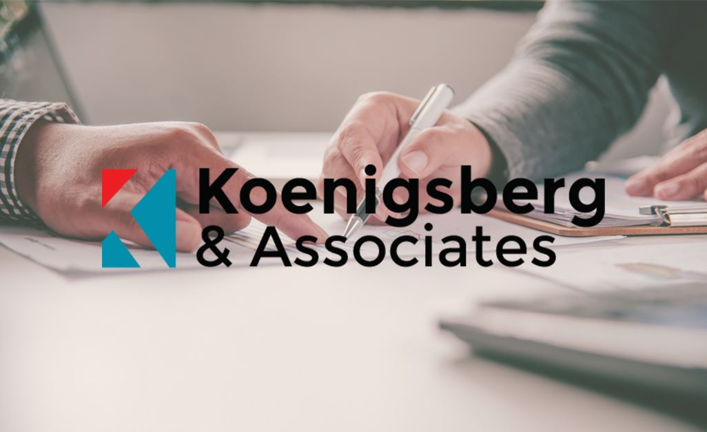 Laywer going over case with client; Koenigsberg & Associates logo overlayed