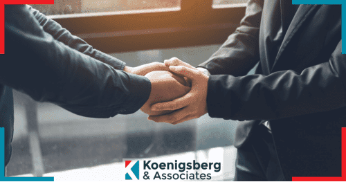 Client gratefully shaking hand with lawyer