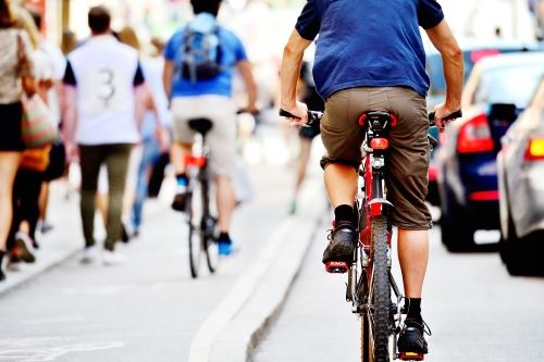 Pedestrians and cyclists on sidewalk