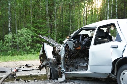 White car heavily damaged after car accident