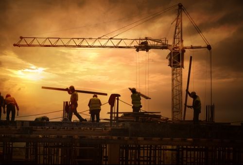 Construction crew during sunrise