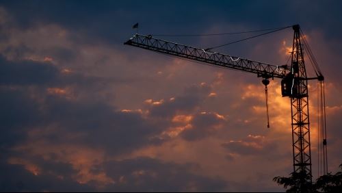 Construction crane at sunrise