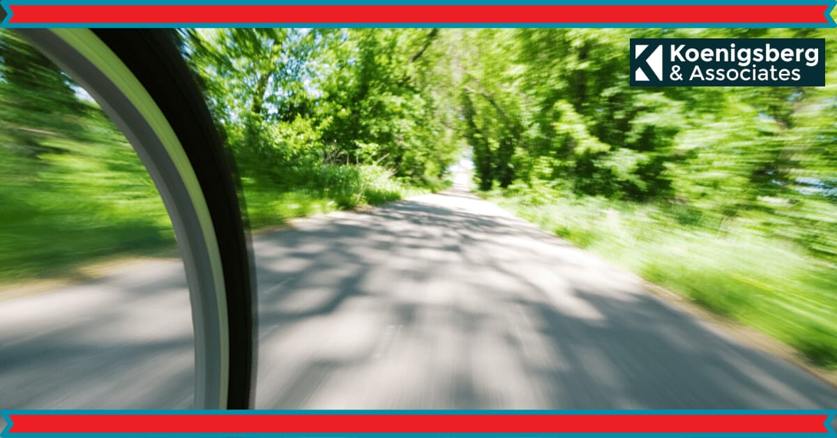 Bicycle zooming down green way path