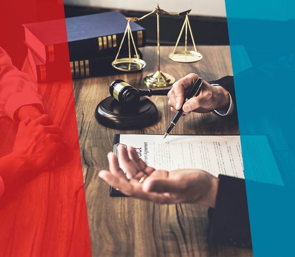 Lawyer discussing case with client at desk.