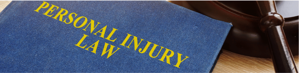 A blue book titled "Personal Injury Law"